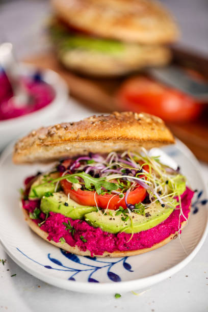 istock Vegan Bagel with Avocado and Beetroot Hummus 2182801583