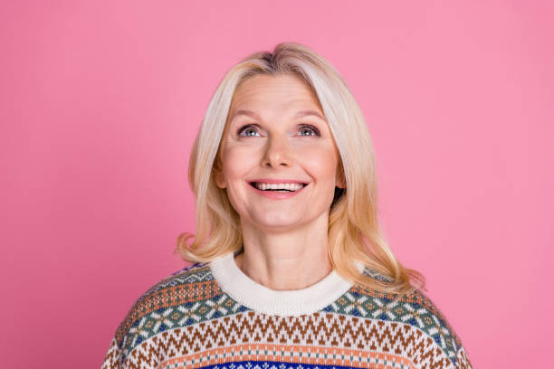 istock Photo of nice aged lady look up empty space wear pullover isolated on pink color background 2182804032
