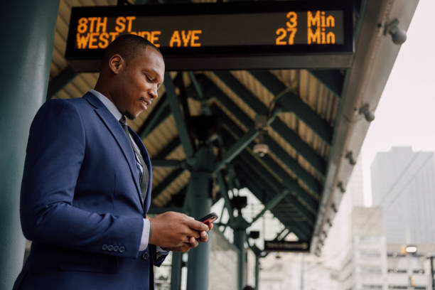 istock Businessman commuting to work. Waiting at the train stop 2182807573