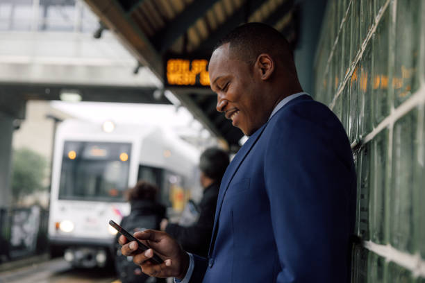istock Businessman commuting to work. Waiting at the train stop 2182807718