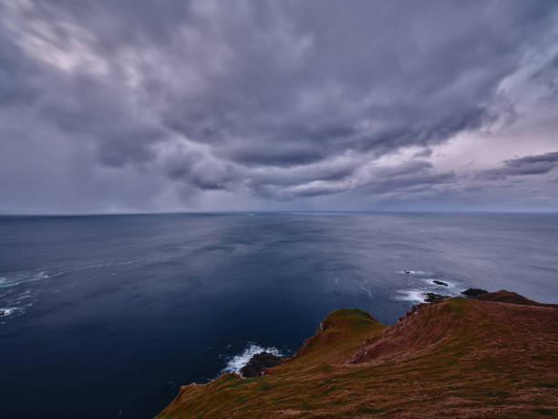 View of the cumulonimbus clouds above the sea at Faroe Islands. Photographed in medium format.