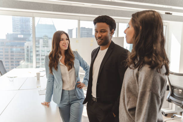 istock Business people talking in modern office with city view 2182808961