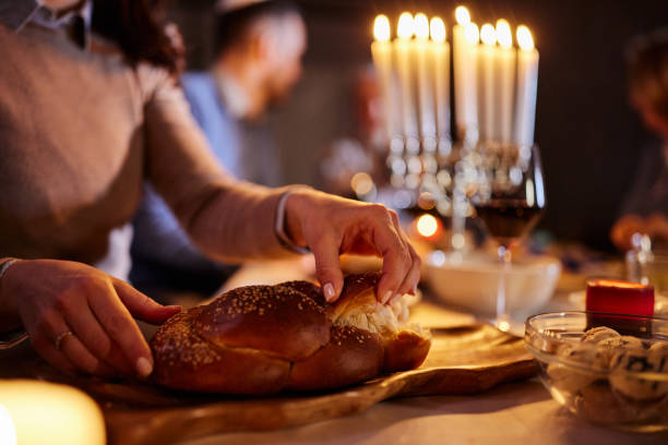 istock Taking piece of challah on Hanukkah! 2182810377