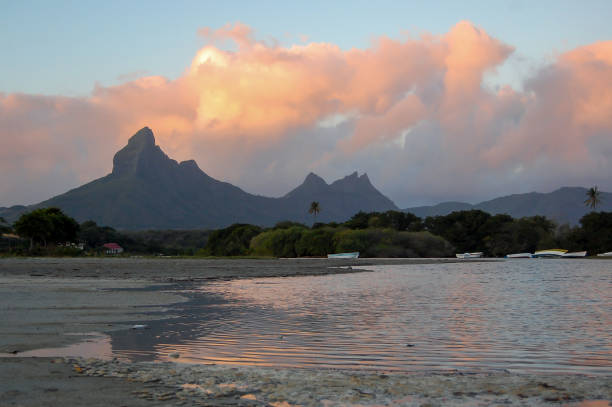 istock Spectacular clouds at sunset over Rempart mountain at Tamarin beach, Mauritius 2182811550