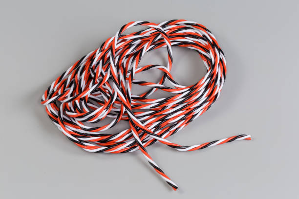 istock Electrical wire bundle, twisted of three wires with varicoloured insulation 2182811973