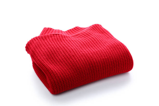 Detailed view of a yellow knitted sweater featuring button closures and a blank clothing label. Highlights texture and fashion design. Perfect for apparel branding and textile concepts.