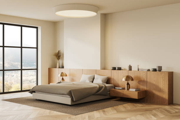 istock Stylish hotel bedroom interior with bed, drawer and panoramic window 2182813937