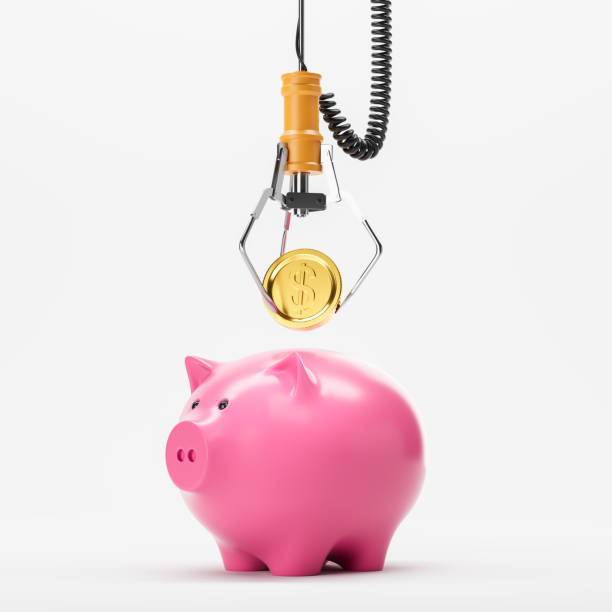 istock Robotic claw put a dollar coin into a piggy bank on white background 2182814489