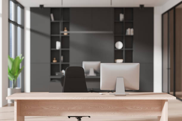 istock Empty wooden work desk on blurred background of ceo room interior 2182814865
