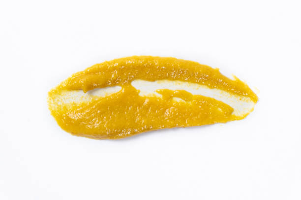 istock Smear of mustard sauce on white background isolate, creativity in cooking, macro texture 2182819707