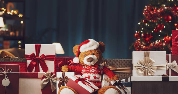 istock Many Christmas gifts and cute teddy bear 2182820807