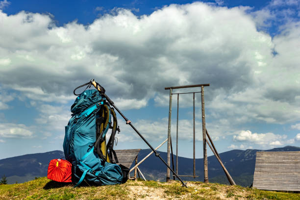 Hiking in the mountains in summer with a backpack and a tent. Beautiful landscape in the mountains.
