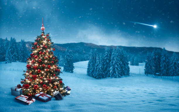 istock Wintry landscape, decorated Christmas tree and gifts 2182821012