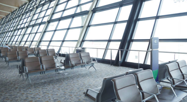 istock abstract in airport for background. OFFICE BACKGROUND, MODERN BUSINESS HALL WITH LIGHT REFLECTONS ON THE FLOOR 2182822637