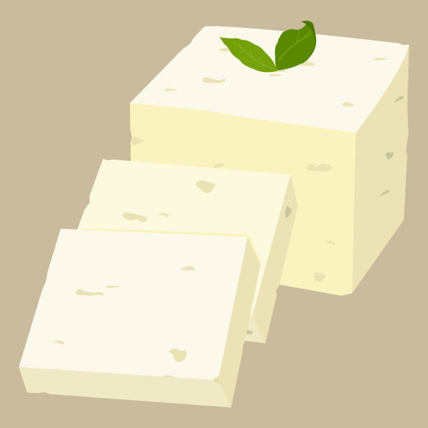 Feta cheese. Sliced white Greek cheese with green leaf on top, pieces cut out of block of feta cheese. Dairy product from Greece. Vector illustration Block of feta cheese with a green leaf on top. Feta cheese, white Greek cheese. Dairy product from Greece, cheese sliced in pieces. Vector illustration feta cheese block stock illustrations
