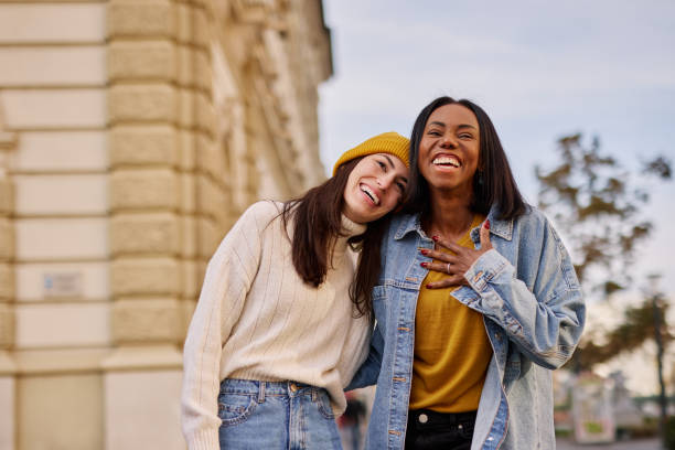 istock Joyful Friends Laughing and Walking Together in Urban Setting 2182825284