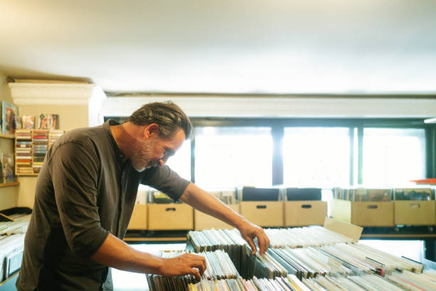 istock Man Choosing Vinyl Records 2182827629