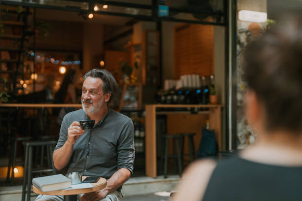 istock Man is reading a book at the coffee shop 2182827646