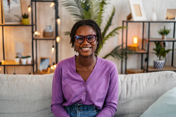 istock Young Woman Sitting On The Sofa At Home 2182828557