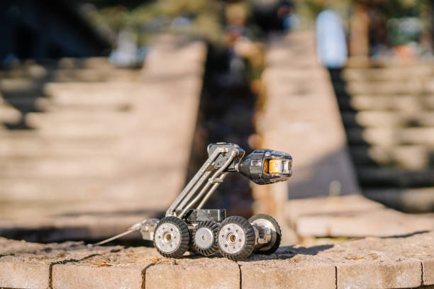 istock A rugged inspection robot positioned on stone steps, highlighting its mobility and adaptability for outdoor and uneven terrain. 2182833606