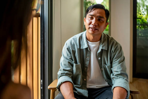 istock Man Engaged in a Thoughtful Conversation Indoors 2182833979