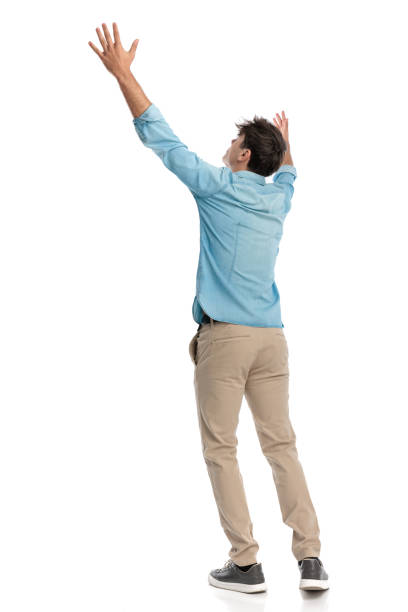istock desperate student raising his hands towards sky asking for guidance 2182838973