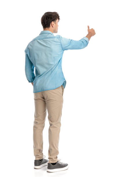 istock back view of casual man making thumbs up gesture 2182839542