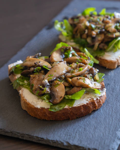 istock Toasted Bread with Ricotta, Arugula, and Mushrooms – Close-Up 2182841499