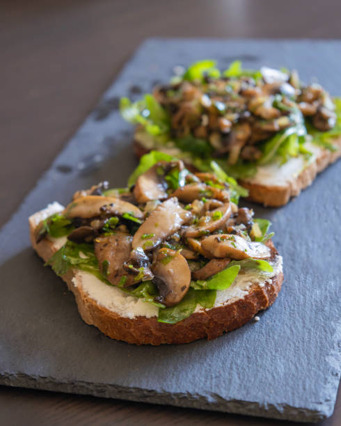 istock Toasted Bread with Ricotta, Arugula, and Mushrooms – Close-Up 2182841502