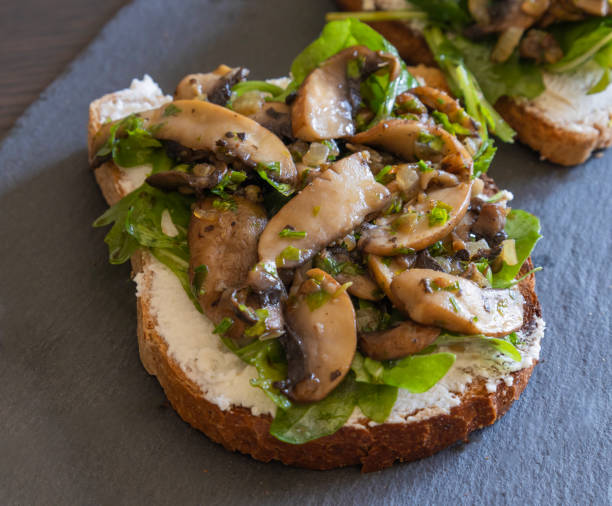 istock Toasted Bread with Ricotta, Arugula, and Mushrooms – Close-Up 2182841520