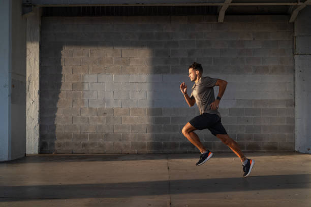 istock Dedicated young athlete sprinting beneath an urban bridge to demonstrate his commitment to fitness and sports 2182844220