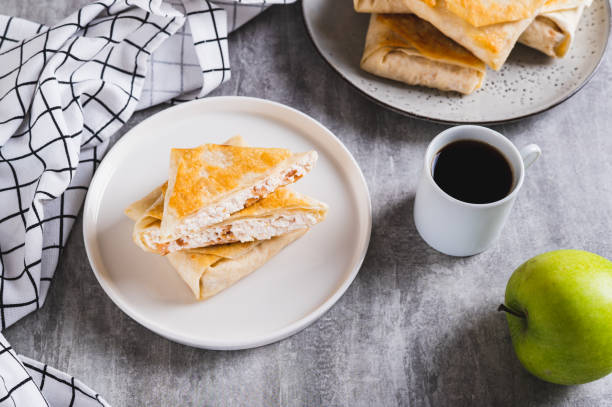 istock Cottage cheese and apple wrapped in fried lavash on a plate on the table 2182845383