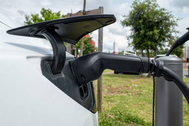 istock Electric car charging at a service station 2182846005