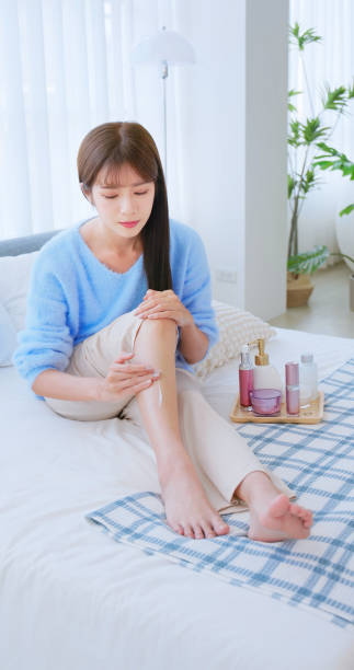 istock asian female fall skincare leg 2182846020