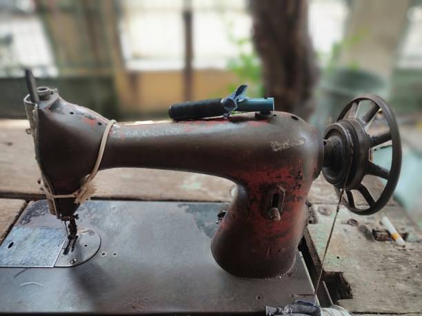 istock Traditional sewing machine embedded in a wooden table. 2182848822