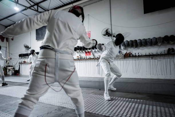 istock Men practicing fencing at a health club 2182851384