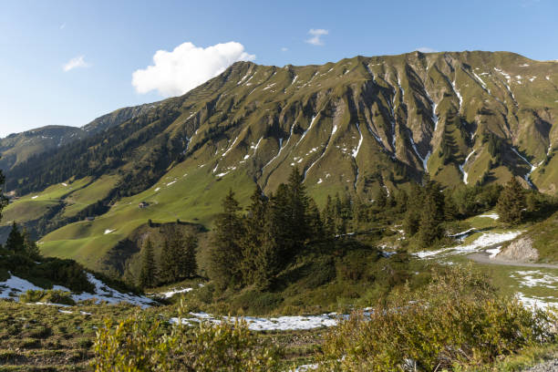 The view of the sunlit Austrian Alps covered in snow from Kanzelwandbahn mountain station on the border between Germany and Austria