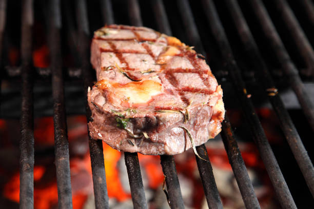 istock Cooking steak on the grill and coals. Roasting steak in a restaurant. 2182852377