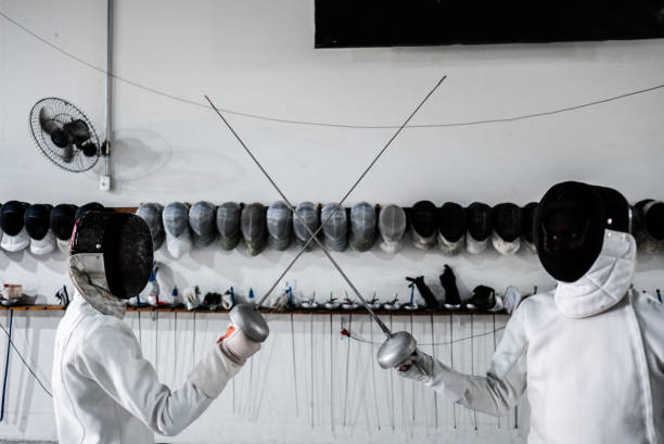 istock Men practicing fencing at a health club 2182853379
