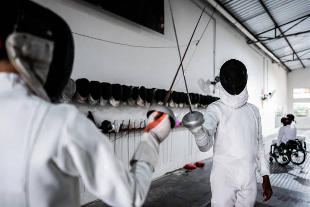 istock Men practicing fencing at a health club 2182853388