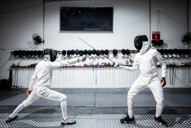 istock Men practicing fencing at a health club 2182853496