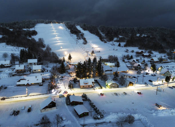 istock Winter ski slope at night with cable car 2182853504