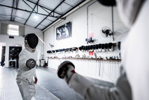 istock Men practicing fencing at a health club 2182853511