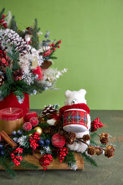 Christmas arrangement with red candles and polar bear
