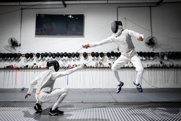 istock Men practicing fencing at a health club 2182853811
