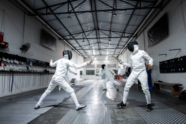 istock Men practicing fencing at a health club 2182854370