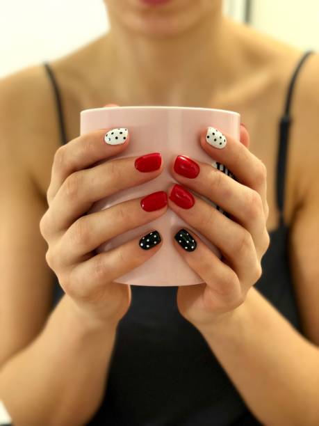 istock Stylish Hands Holding a Cup of Coffee 2182856101