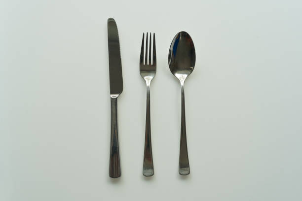 istock Top view of table knife table fork and tabel spoon against white background. 2182860093