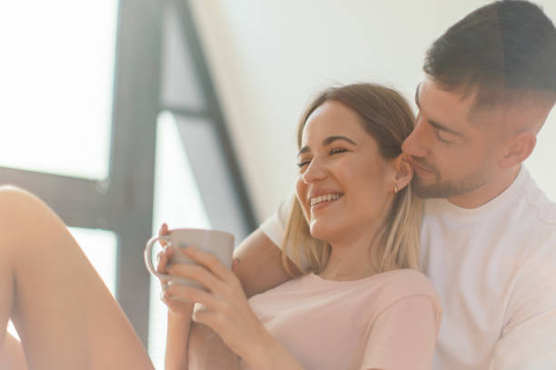 istock Couple drinking coffee in bed 2182864479