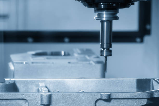 istock The CNC milling machine cutting mold parts with flat end mill tool in the light blue scene. 2182865082